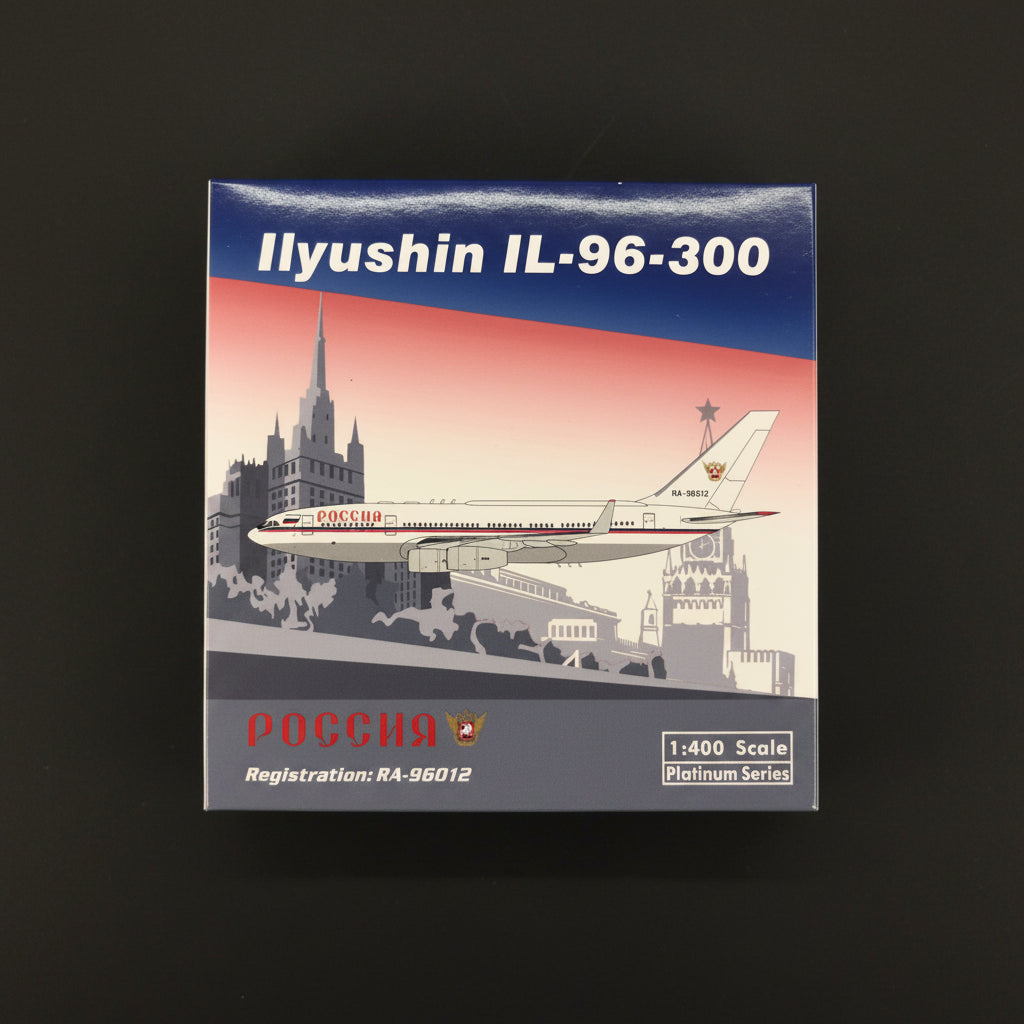 Model airplane kit box for Ilyushin IL-96-300 with Russian architecture illustration on a textured surface.