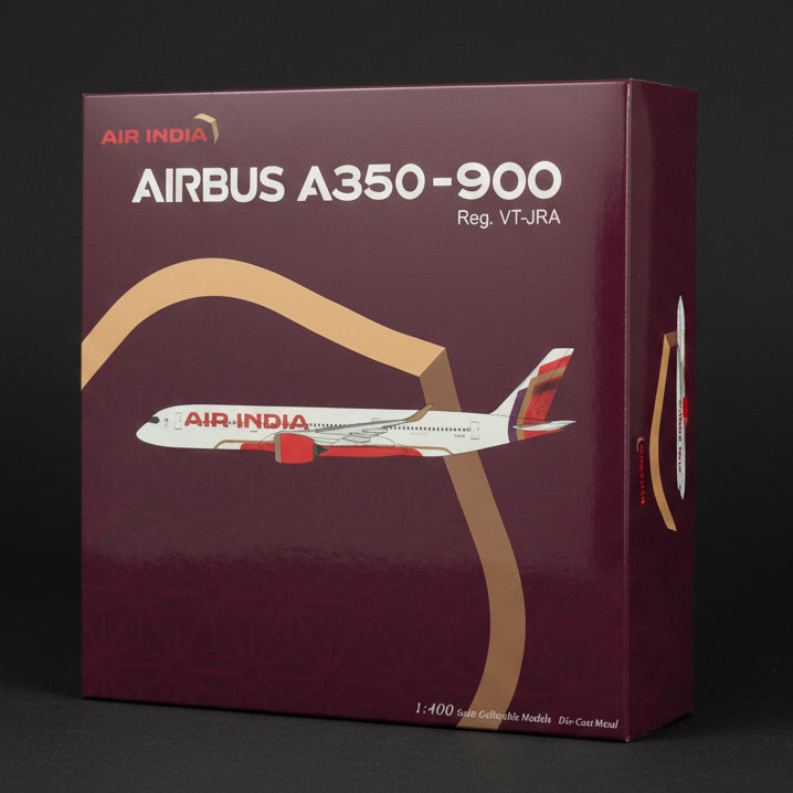 Model airplane packaging for Airbus A350-900 with Air India branding on a textured surface.